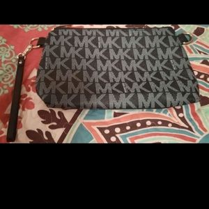 Michael kors Wristlet/Clutch. Zips up, 1 strap